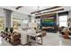 Bright and airy living room featuring modern furniture, stylish decor, and a view of the outdoors at 960 Club Cresswind Dr, Lady Lake, FL 32159