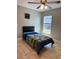 Inviting bedroom with tiled flooring and a large window offering natural light at 112 Tulip Ln, Kissimmee, FL 34759