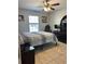Cozy bedroom with neutral tones, tiled flooring, and ample natural light at 112 Tulip Ln, Kissimmee, FL 34759