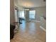 Bright dining area with a modern chandelier and access to the outdoor space at 112 Tulip Ln, Kissimmee, FL 34759