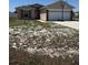 Charming single-Gathering home with a two-car garage and a basketball hoop at 112 Tulip Ln, Kissimmee, FL 34759