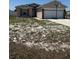 Charming single-Gathering home with a two-car garage and a basketball hoop at 112 Tulip Ln, Kissimmee, FL 34759