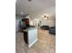 Open concept living room with modern furniture and seamless flow into the kitchen at 112 Tulip Ln, Kissimmee, FL 34759