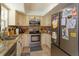 Well-equipped kitchen with stainless steel appliances and ample cabinet space at 11435 Aries Dr, Orlando, FL 32837