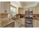 Kitchen featuring stainless steel appliances, granite countertops, and tile backsplash at 11435 Aries Dr, Orlando, FL 32837