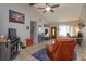 Cozy living room featuring vaulted ceilings, tile floors, and comfortable seating at 11435 Aries Dr, Orlando, FL 32837