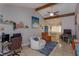 Open-concept living room with vaulted ceilings, tile floors, and an adjacent dining area at 11435 Aries Dr, Orlando, FL 32837