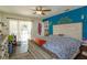 Spacious main bedroom with hardwood floors, a ceiling fan, and ample natural light at 11435 Aries Dr, Orlando, FL 32837
