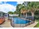 Outdoor oasis with a fenced pool and hot tub, ideal for summer relaxation and entertaining at 11435 Aries Dr, Orlando, FL 32837