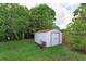 Outdoor shed in a well-maintained backyard, providing ample storage space and organization at 11435 Aries Dr, Orlando, FL 32837