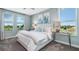 Comfortable bedroom with plush carpeting, large windows, and serene views at 1217 Reunion Village Blvd, Kissimmee, FL 34746