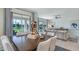 Open-concept dining area with luxury finishes and seamless access to outdoor space at 1217 Reunion Village Blvd, Kissimmee, FL 34746