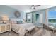 Serene main bedroom with soothing decor, ample natural light, and stylish furnishings at 1217 Reunion Village Blvd, Kissimmee, FL 34746