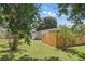 Lush backyard with green grass, a new wooden privacy fence, and plenty of shade at 1301 Lawne Blvd, Orlando, FL 32808