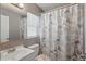 Bright bathroom with a vanity, toilet, and shower with a decorative Eiffel Tower shower curtain at 1301 Lawne Blvd, Orlando, FL 32808