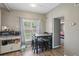Bright dining area with a view of the backyard, adjacent to the kitchen and living spaces at 1301 Lawne Blvd, Orlando, FL 32808