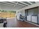 Covered patio boasts brick floors, washer and dryer, and easy access to the backyard at 1301 Lawne Blvd, Orlando, FL 32808
