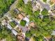 Aerial view of a neighborhood featuring mature trees, residential homes, and cul-de-sacs at 1307 Jean Ct, Eustis, FL 32726