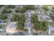 This aerial shot displays a neighborhood, highlighting the location of the house among mature trees and other homes at 13419 Sw 77Th Ave, Ocala, FL 34473