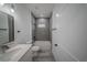 Full bathroom featuring a tub and shower combination, single sink vanity, and gray accent tiles at 13419 Sw 77Th Ave, Ocala, FL 34473