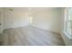 Spacious bedroom boasts wood-look flooring, neutral walls, and natural light at 13419 Sw 77Th Ave, Ocala, FL 34473