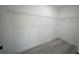 Walk-in closet featuring installed shelving and wood-look flooring at 13419 Sw 77Th Ave, Ocala, FL 34473
