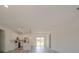 Open living room featuring an open floor plan, white cabinetry, stainless steel appliances, and lots of natural light at 13419 Sw 77Th Ave, Ocala, FL 34473