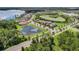 An aerial view of the community showcasing the beautiful landscaping, lakes, and well-maintained homes at 14781 Old Thicket Trce, Winter Garden, FL 34787