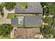 An overhead aerial view shows a home featuring a screened in pool and neighboring homes at 14781 Old Thicket Trce, Winter Garden, FL 34787