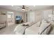 Relaxing primary bedroom boasts a view into the ensuite bathroom at 14781 Old Thicket Trce, Winter Garden, FL 34787