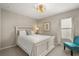 Charming bedroom with white furniture and a decorative ceiling fan at 14781 Old Thicket Trce, Winter Garden, FL 34787
