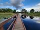 Scenic boardwalk over a lily pad filled pond with blue sky reflections at 14781 Old Thicket Trce, Winter Garden, FL 34787