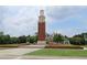 Grand clock tower landmark in a community with beautifully landscaped grounds and well-maintained lawns at 14781 Old Thicket Trce, Winter Garden, FL 34787
