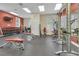 Spacious gym area featuring weight machines and free weights for a complete workout at 14781 Old Thicket Trce, Winter Garden, FL 34787