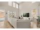 Spacious living room with vaulted ceilings, abundant natural light, and seamless access to the outdoor area at 14781 Old Thicket Trce, Winter Garden, FL 34787