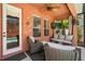 Relaxing covered patio with comfortable seating, ceiling fan, and outdoor television for ultimate entertainment at 14781 Old Thicket Trce, Winter Garden, FL 34787