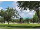 A colorful playground featuring modern play structures and shaded areas, perfect for Gathering fun at 14781 Old Thicket Trce, Winter Garden, FL 34787