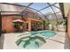 Enjoy the refreshing pool and spa area with a covered patio, perfect for outdoor living and entertaining at 14781 Old Thicket Trce, Winter Garden, FL 34787
