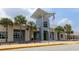 Exterior of Bridgewater Middle School with a flag and palm trees at 14781 Old Thicket Trce, Winter Garden, FL 34787