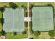 Aerial view of basketball and tennis courts surrounded by manicured landscaping at 14781 Old Thicket Trce, Winter Garden, FL 34787