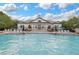 Relaxing community pool with lounge chairs perfect for sunbathing on a beautiful day at 14781 Old Thicket Trce, Winter Garden, FL 34787