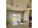 Bright kitchen area with white countertops, sliding glass doors to the backyard, and modern decor at 17148 Cagan Crossings Blvd, Clermont, FL 34714