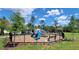 Community playground area with a variety of play structures and a fenced perimeter at 17148 Cagan Crossings Blvd, Clermont, FL 34714