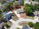 An aerial view of a single-Gathering home with a large yard and mature trees in a residential neighborhood at 1742 Willa Cir, Winter Park, FL 32792