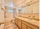 Bathroom featuring a double sink vanity and a tiled shower/tub combination at 1742 Willa Cir, Winter Park, FL 32792