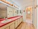 Double sink bathroom with vanity and an adjoining room at 1742 Willa Cir, Winter Park, FL 32792
