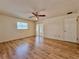 Empty bedroom with wood-look floors, a sliding glass door, a closet and a ceiling fan at 1742 Willa Cir, Winter Park, FL 32792