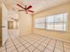 Bedroom with neutral paint, tile flooring, ceiling fan, and natural light from window at 1742 Willa Cir, Winter Park, FL 32792