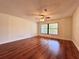 Bright bedroom with wood floors, neutral paint, and ample natural light from a large window at 1742 Willa Cir, Winter Park, FL 32792