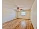 Empty bedroom with wood-look floors, a window, and a ceiling fan at 1742 Willa Cir, Winter Park, FL 32792